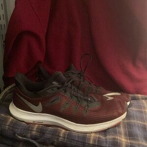 Burgundy red Nike running shoes